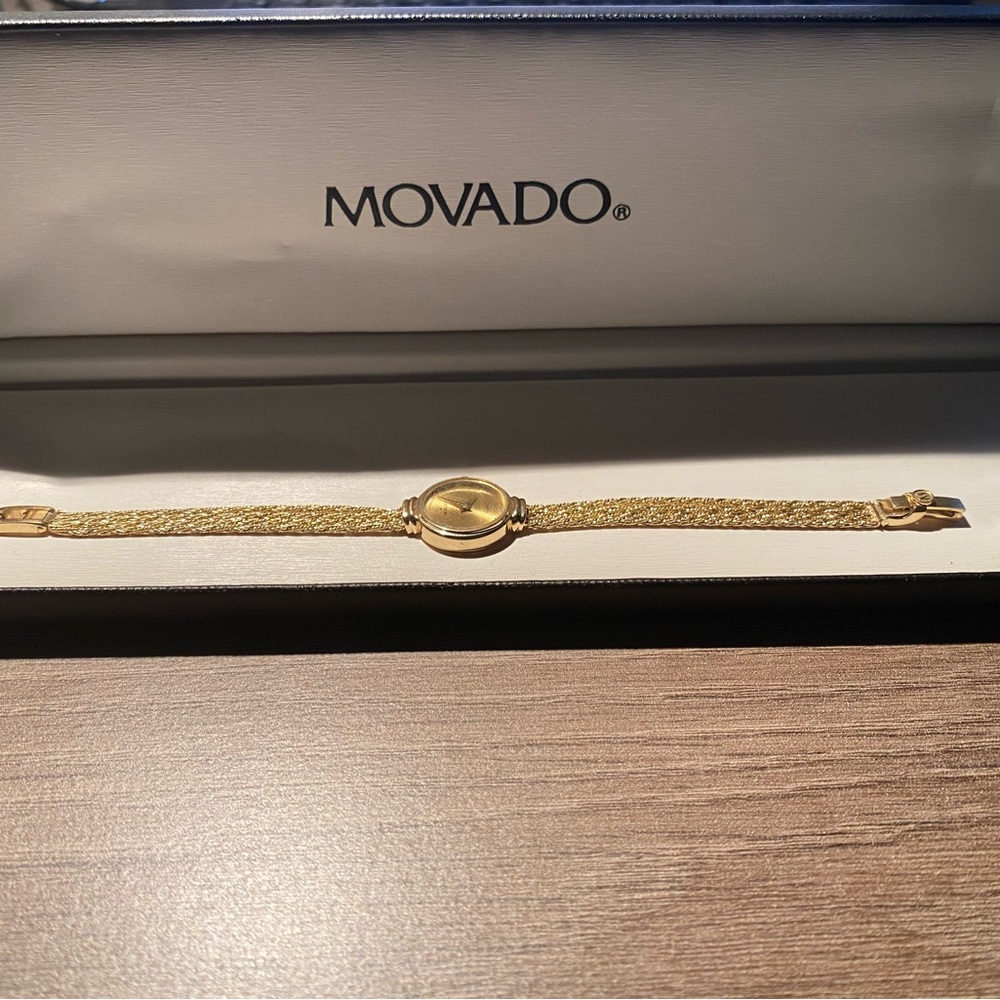 Movado gold bracelet watch with case